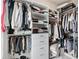 Organized walk-in closet featuring ample shelving and hanging space for optimal storage at 3786 Alstead Manor Way, Suwanee, GA 30024
