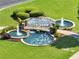 Landscaped water feature with multiple tiers and fountain in lush green community at 3786 Alstead Manor Way, Suwanee, GA 30024