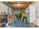 This unfinished basement presents a blank canvas with exposed beams, plumbing, and a door leading to stairs at 504 S Westminster Ne Way, Atlanta, GA 30307