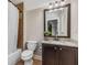 Bathroom showcases vanity with granite counters and decorative framed mirror at 504 S Westminster Ne Way, Atlanta, GA 30307
