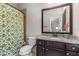 Bright bathroom features vanity with granite counters and a decorative shower curtain at 504 S Westminster Ne Way, Atlanta, GA 30307