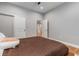 This bedroom boasts ample natural light, light gray walls, hardwood floors, and a neutral color palette at 504 S Westminster Ne Way, Atlanta, GA 30307