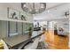 Elegant dining room with modern light fixture, long table, and built-in bench seating at 504 S Westminster Ne Way, Atlanta, GA 30307