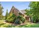Charming brick home with meticulously landscaped grounds and mature trees for added privacy at 504 S Westminster Ne Way, Atlanta, GA 30307