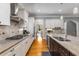 Bright, spacious kitchen boasts stainless steel appliances, granite countertops, and hardwood floors at 504 S Westminster Ne Way, Atlanta, GA 30307