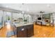 Open-concept kitchen featuring a large center island, hardwood floors, and seamless flow to the living space at 504 S Westminster Ne Way, Atlanta, GA 30307