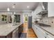 Modern kitchen features stainless appliances, white cabinets, granite countertops and hardwood flooring at 504 S Westminster Ne Way, Atlanta, GA 30307