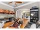 Inviting living room with hardwood floors, a ceiling fan, view into the dining area and a desk at 504 S Westminster Ne Way, Atlanta, GA 30307