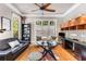 Inviting living room with a fan, windows, a desk, and hardwood floors with a cowhide rug at 504 S Westminster Ne Way, Atlanta, GA 30307