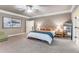 Spacious main bedroom with neutral colors, carpeted floors, large windows, and an ensuite bathroom at 504 S Westminster Ne Way, Atlanta, GA 30307