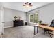 Bright office features neutral paint, a rainbow ceiling fan, and large window at 504 S Westminster Ne Way, Atlanta, GA 30307