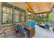 This charming screened porch is perfect for relaxation, with comfortable seating and views of the lush greenery at 504 S Westminster Ne Way, Atlanta, GA 30307