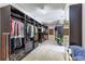 Large walk-in closet with custom shelving, hanging rods, and ample storage space at 504 S Westminster Ne Way, Atlanta, GA 30307