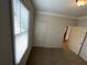 This is a carpeted bedroom with a window at 937 Capitol View Nw Ave, Atlanta, GA 30318