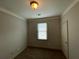 This is a carpeted bedroom with a window at 937 Capitol View Nw Ave, Atlanta, GA 30318