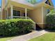Charming home featuring a welcoming front porch with classic white columns and a well-manicured hedge at 937 Capitol View Nw Ave, Atlanta, GA 30318