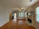Inviting living room featuring a fireplace, hardwood floors, and ample natural light, ideal for relaxation and comfort at 937 Capitol View Nw Ave, Atlanta, GA 30318
