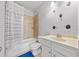 This bathroom features tile shower with tub and light colored sink at 132 Shellbark Dr, Mcdonough, GA 30252