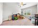 This is a bedroom that has lots of personal items and a lot of natural light at 132 Shellbark Dr, Mcdonough, GA 30252