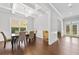 Bright dining room featuring hardwood floors, coffered ceilings, and elegant chandelier at 132 Shellbark Dr, Mcdonough, GA 30252