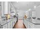 Modern kitchen with granite countertops, stainless steel appliances, and pendant lighting over the island at 132 Shellbark Dr, Mcdonough, GA 30252