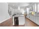 Spacious kitchen features a large island with bar seating and modern appliances for a chef's delight at 132 Shellbark Dr, Mcdonough, GA 30252