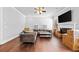 Bright living room features hardwood floors, a fireplace, and ample space for relaxation and entertaining at 132 Shellbark Dr, Mcdonough, GA 30252