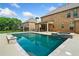 Beautiful pool offers a serene escape, complete with stone accents and clear blue water for ultimate relaxation at 132 Shellbark Dr, Mcdonough, GA 30252