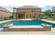 Gorgeous backyard features a sparkling pool and spa, creating a private oasis for leisure and recreation at 132 Shellbark Dr, Mcdonough, GA 30252