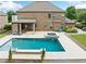 Incredible backyard showcasing a large pool, hot tub, patio, with ample space for outdoor entertaining and relaxation at 132 Shellbark Dr, Mcdonough, GA 30252