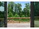 Backyard view shows a wooden deck and patio with natural view of lush greenery at 1610 Niskey Lake Rd, Atlanta, GA 30331