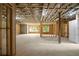 Spacious unfinished basement with exposed wood framing and natural light from windows at 1610 Niskey Lake Rd, Atlanta, GA 30331