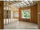 Framed basement with a window view showcasing a potential for a livable space at 1610 Niskey Lake Rd, Atlanta, GA 30331