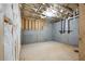 Unfinished basement featuring concrete walls, exposed beams, and framed insulation on exterior walls at 1610 Niskey Lake Rd, Atlanta, GA 30331