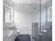 Modern bathroom with dual vessel sinks, granite counters, herringbone tile flooring, and a frameless glass shower at 1610 Niskey Lake Rd, Atlanta, GA 30331