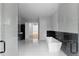 Modern bathroom featuring glass shower, freestanding tub and black marble accents at 1610 Niskey Lake Rd, Atlanta, GA 30331