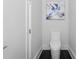 Modern bathroom with sleek toilet, light gray walls, and dark floors at 1610 Niskey Lake Rd, Atlanta, GA 30331