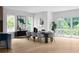 Elegant dining room with large windows, a stylish table setting, and a contemporary design for gatherings at 1610 Niskey Lake Rd, Atlanta, GA 30331