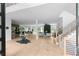 Spacious foyer with hardwood floors and a view into the kitchen, dining area, and living room, enhanced by natural light at 1610 Niskey Lake Rd, Atlanta, GA 30331