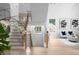 Bright foyer featuring hardwood floors, staircase, and large windows with natural light at 1610 Niskey Lake Rd, Atlanta, GA 30331