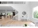 Bright foyer features an open staircase with wooden handrail and modern black railings, and a light wood floor at 1610 Niskey Lake Rd, Atlanta, GA 30331