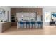 Modern kitchen features stylish lighting, stainless appliances, and central island with breakfast bar seating at 1610 Niskey Lake Rd, Atlanta, GA 30331