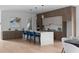 Modern kitchen with a large island, stylish blue chairs, and high-end appliances for a chef's dream at 1610 Niskey Lake Rd, Atlanta, GA 30331