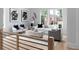 Bright living room with luxury furniture and large windows overlooking landscaped yard at 1610 Niskey Lake Rd, Atlanta, GA 30331