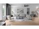 Bright living room boasts a modern fireplace, plush seating, and light hardwood floors for a welcoming atmosphere at 1610 Niskey Lake Rd, Atlanta, GA 30331