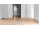 An open-concept living room with hardwood flooring, bright light and an adjacent bath at 1610 Niskey Lake Rd, Atlanta, GA 30331