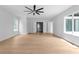 Open-concept living room with bright natural light, hardwood floors, and high ceilings at 1610 Niskey Lake Rd, Atlanta, GA 30331