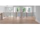 Spacious living area with lots of natural light, hardwood floors, and modern railing at 1610 Niskey Lake Rd, Atlanta, GA 30331