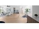 Open-concept living area showcases light hardwood floors, a staircase, and stylish furnishings for modern living at 1610 Niskey Lake Rd, Atlanta, GA 30331