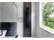 Contemporary shower with sleek fixtures, modern tile design and natural light from a window at 1610 Niskey Lake Rd, Atlanta, GA 30331